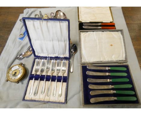 A large collection of silver plated cutlery, five set of plated cutlery, vintage clock etc