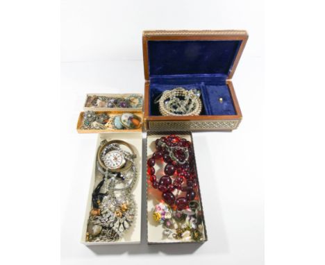 A good collection of vintage costume jewellery, to include faux amber beads, Scottish brooches, paste and porcelain panel bro