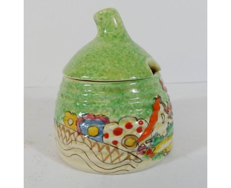 A Clarice Cliff preserve pot and cover in the chalet pattern