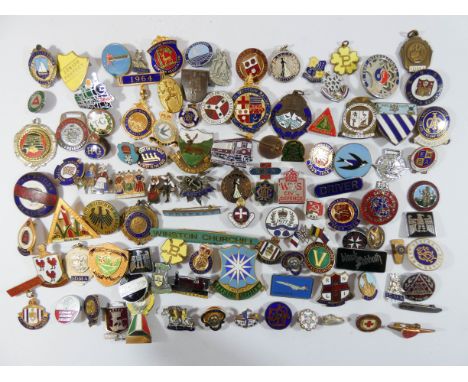 A collection of over one hundred enamel badges, fobs etc to include Women's Institute, National Savings, Home Guard, School b