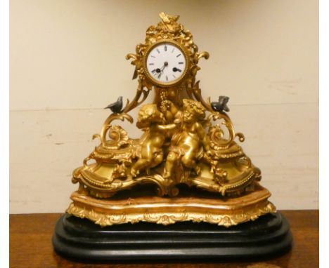 A French ormolu cherub and dove decorated mantel clock with bell strike, stamped on back of movement JL 852 standing on a gil