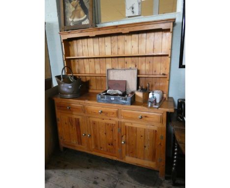 A modern pine kitchen dresser with shelf back, drawers and cupboards under 5'3 wide 