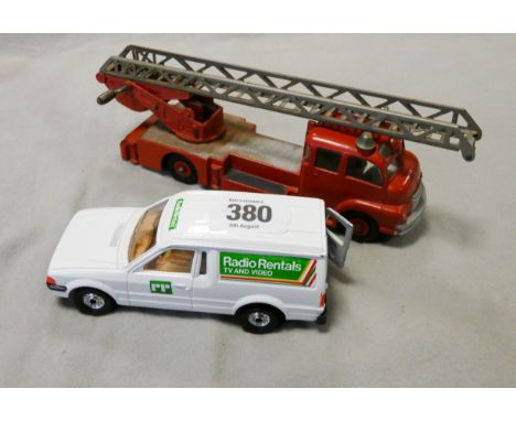 A Corgi Ford Escort and a Dinky Super toy fire Truck with ladder 