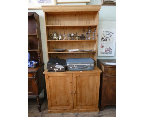 A stripped pine kitchen dresser with shelf back and cupboards under, 3'6 wide