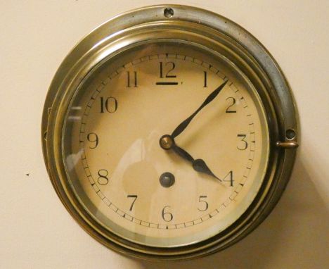 A Circular brass cased ships clock 