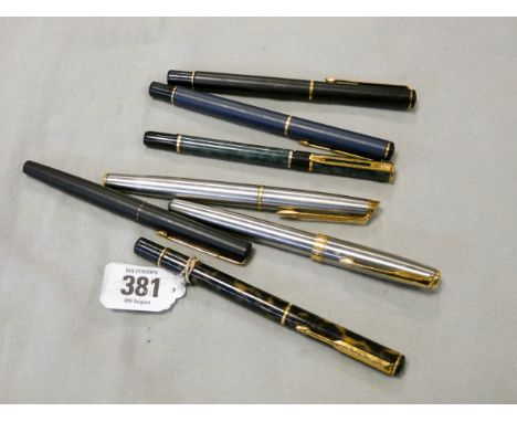 A collection of vintage and modern fountain pens and ball point pens 