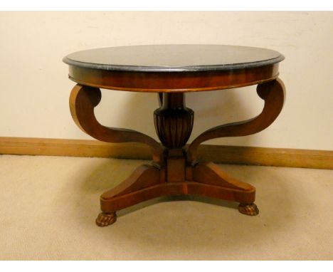 A circular Victorian Biedermeir mahogany centre table on pillar and tripod base with a black fleck marble top, 39" diameter 