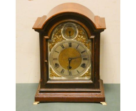 An Edwardian chiming bracket clock in mahogany case with arched brass and silver dial 