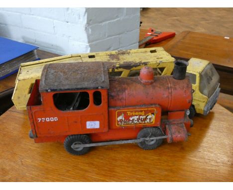 A Triang tin Puff Puff train engine and a Tonka car transporter both in used condition