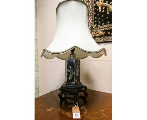 A Chinese decorated porcelain table lamp on wooden stand with pale green shade 