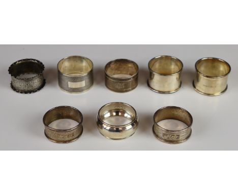 Eight various hallmarked silver napkin rings including a heavy engine turned example and a pair, weight of all 138g