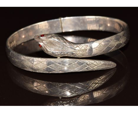 A hallmarked silver bangle in the form of a serpent, London 1973, 28g