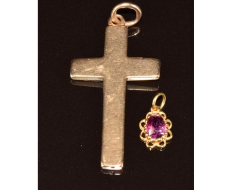 A c1900 15ct gold cross pendant (4.5cm, 3.2g) and a 9ct gold pendant set with an oval cut ruby of approximately 0.6ct&nbsp;(0