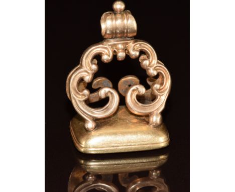A yellow metal c1910 fob set with a carnelian intaglio seal 'per mare per terras' translating to 'by land by sea' which is th