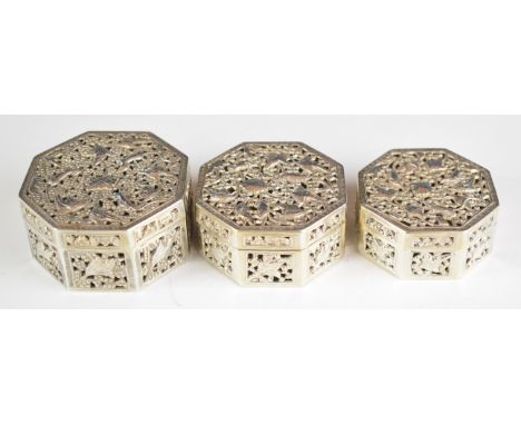 Three Chinese, Burmese or similar octagonal silver trinket pots with pierced lids decorated with mice amongst foliage, all wi