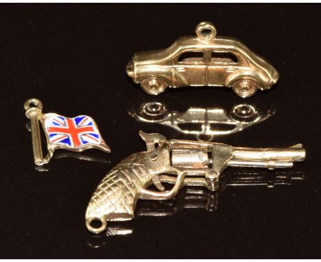 Three 9ct gold charms in the form of an enamel flag, gun and car, 3.3g&nbsp;