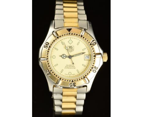 Tag Heuer 2000 gentleman's wristwatch ref. 964-013 with date aperture, luminous hands and hour markers, gold bezel, stainless