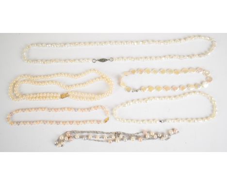 A double strand cultured pearl necklace with 14k gold clasp, a single strand of cultured pearls with 14k gold clasp and four 