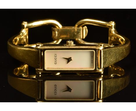 Gucci ladies wristwatch ref. 1500 L with gold dauphine hands, mother of pearl rectangular dial, gold plated case and quartz m