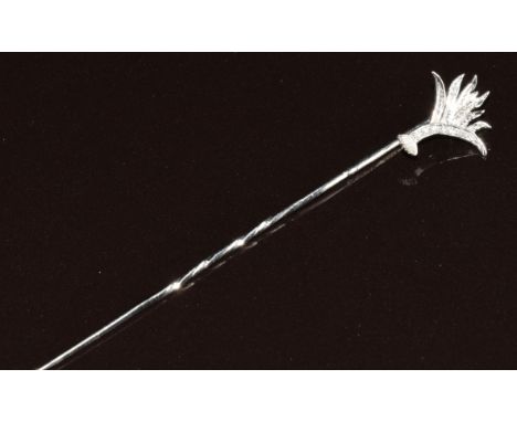 An 18ct white gold stick pin in the form of a leek (Welsh Guards) set with diamonds, 2g, 7cm