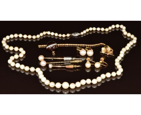 A single strand of cultured pearls with 10k white gold clasp, pair of 9ct gold earrings set with pearls, pair of cultured pea