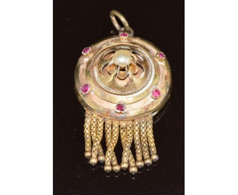 Victorian yellow metal pendant set with a split pearl and rubies, verso a locket compartment with further tassel decoration, 