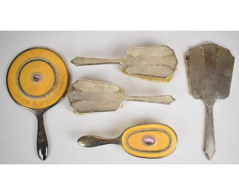 Art Deco hallmarked silver hand mirror and two brushes together with a silver plated hand mirror and brush
