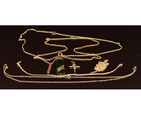 Four&nbsp;9ct gold chains, 9ct gold bracelet, 9ct gold crucifix, 9ct gold pendant set with garnets (8.7g) and a nephrite jade