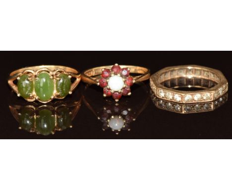 Three 9ct gold rings including eternity ring, opal and garnet cluster and nephrite jade, 6.3g, size K, L &amp; N