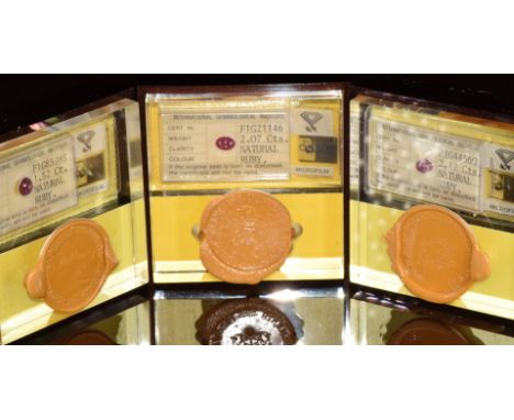 Three ruby cabochons measuring 2.07ct, 2.17ct &amp; 1.52ct, in original sealed display cases