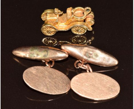A pair of 9ct rose gold cufflinks and a 9ct gold charm in the form of a car opening to reveal the engine, 9.9g&nbsp;