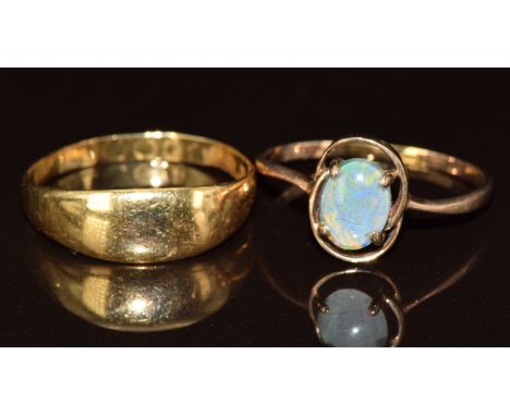 An 18ct gold ring (2.7g, Birmingham 1888) and a 9ct gold ring set with an opal triplet (1.5g)