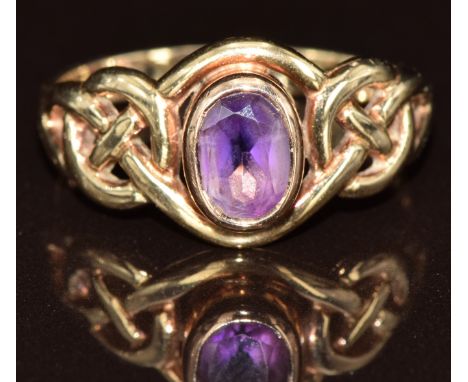 A 9ct gold Celtic Welsh gold ring set with an amethyst, 2.7g, size N