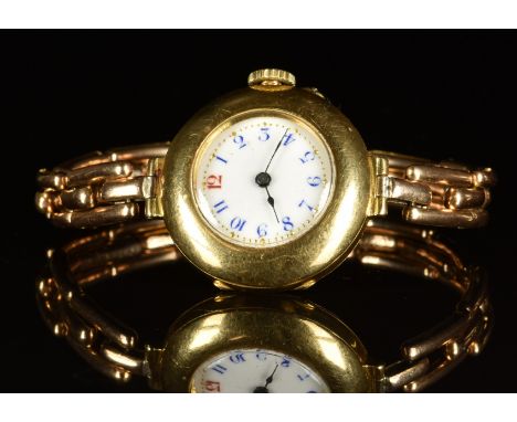 Unnamed 18ct gold ladies wristwatch with blued hands, blue Arabic numerals, white enamel dial and unsigned movement, on 15ct 