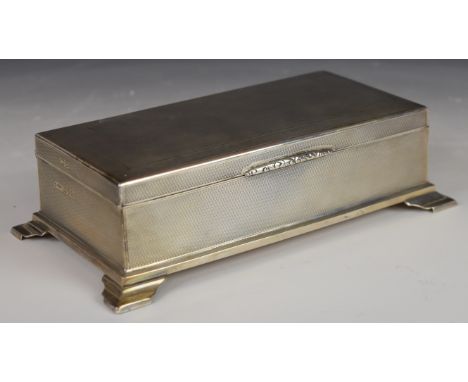 Art Deco hallmarked silver cigarette box with engine turned decoration, raised on four feet, Chester 1932, maker&nbsp;E J Tre