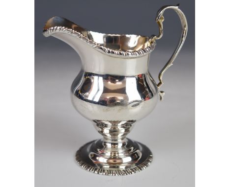 George V hallmarked silver helmet shaped cream jug in the Georgian style, with gadrooned edge, London 1930, maker&nbsp;C S Ha