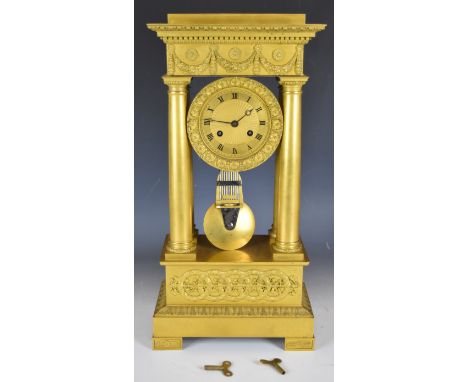 19th century French Empire style gilt metal four column mantel clock, the two train movement striking on a bell and having gr