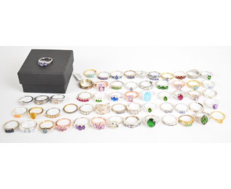 Fifty seven silver rings including ruby, cubic zirconia, amethyst, tanzanite, garnet and opal, 161g