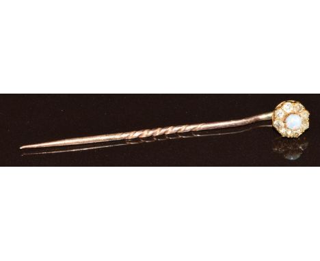 Gold stick pin set with an opal and diamonds, in Newport box