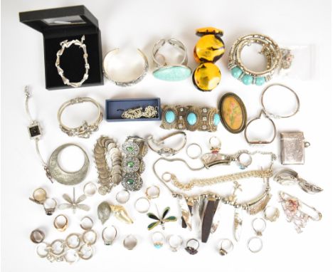 A collection of jewellery including twelve silver rings, one set with a ruby, silver bangle, silver vesta, two silver bracele