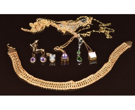 A collection of 9ct gold jewellery comprising five chains, four pendants set with opal, cubic zirconia, amethyst and diamond 