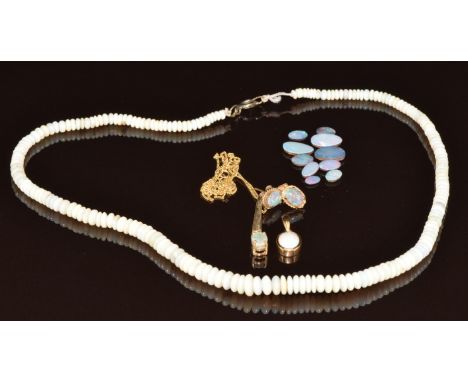 A 9k gold pendant set with a Lightning Ridge black opal and topaz on 9ct gold chain, a 9ct gold pendant set with an opal, a p