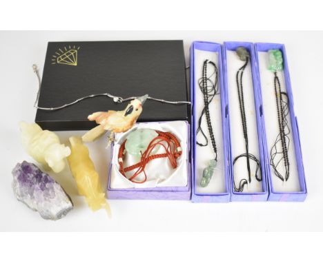 A collection of jewellery and hardstone including jade style pendants, silver necklace, etc&nbsp;