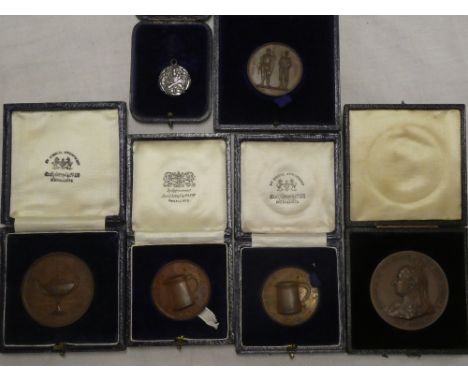 Six various cased medallions including bronze Astor County Shooting Cup medallions, bronze 1897 Jubilee medallion etc