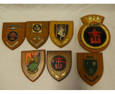 A Naval wall plaque "3 Troop RA" and six various Military plaques including Command Light Battery RA, Naval Gun-fire Support 