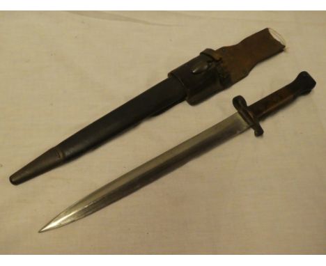 An 1887 patern Lee Metford bayonet by Wilkinson of London dated '05 with double edged steel blade in leather scabbard with le