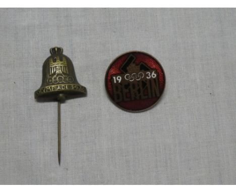 A German 1936 Olympic stick pin and similar enamelled badge