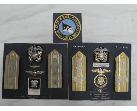 A display of US Navy insignia including Admirals epaulettes and badges serving as a Presidential Aid in The White House, Rear