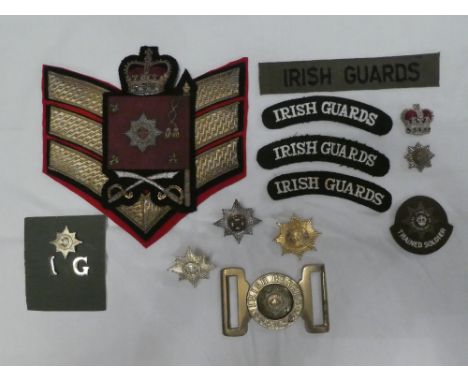 A collection of Irish Guards badges and insignia including Officers silver and enamel cap badge, Colour Sergeant's rank insig