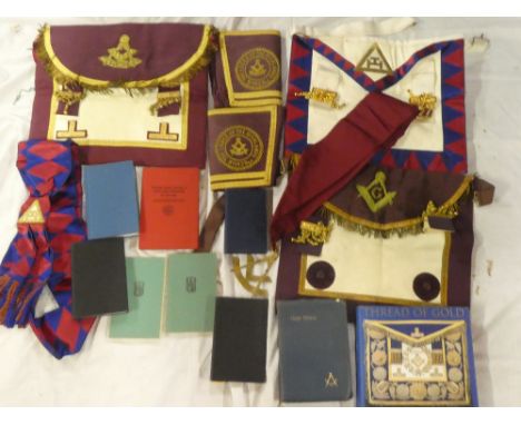 A selection of Masonic regalia including Lodge of the Highlands cuffs, two aprons, sash with pendant, various publications et